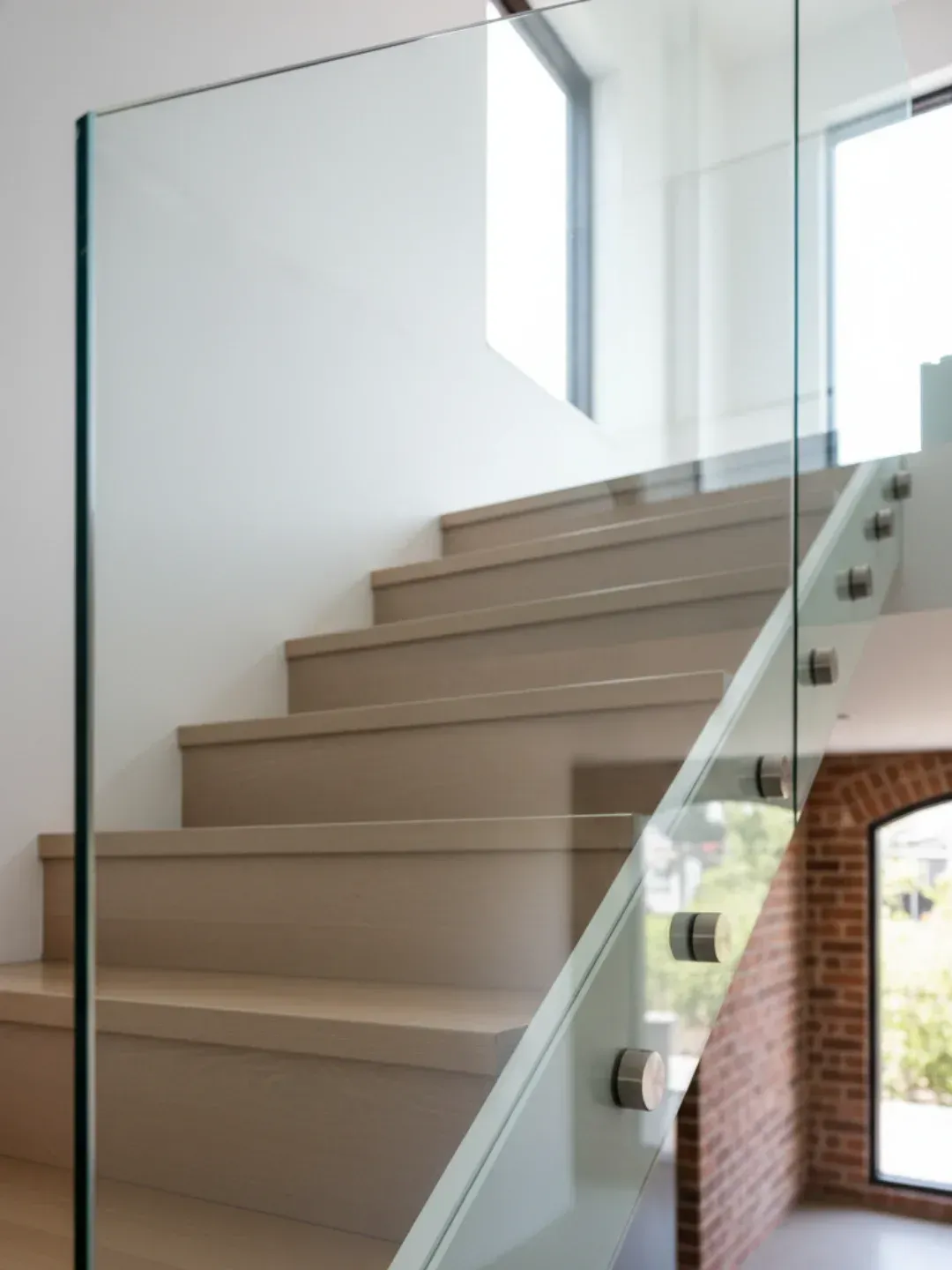 Pin-fixed standoff glass balustrades Ascot with floating glass effect using marine grade stainless steel fittings.