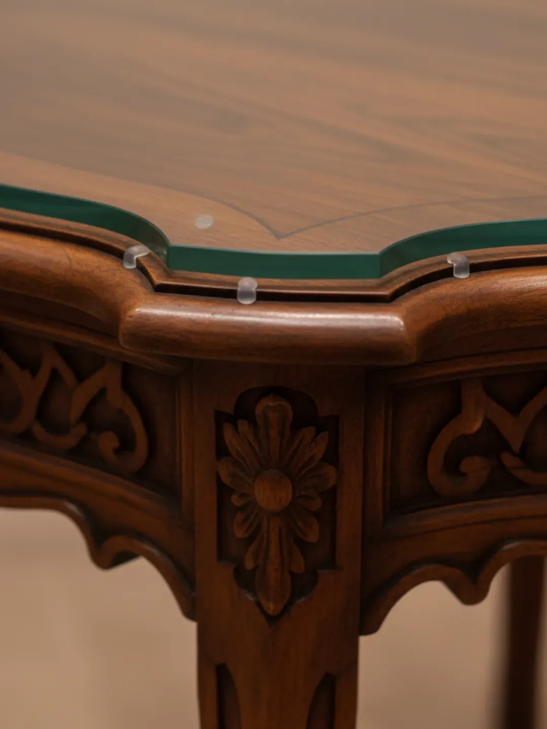 Pattern-cut glass protector in Ascot fitted to curved antique timber table with protective air-gap bumpers.