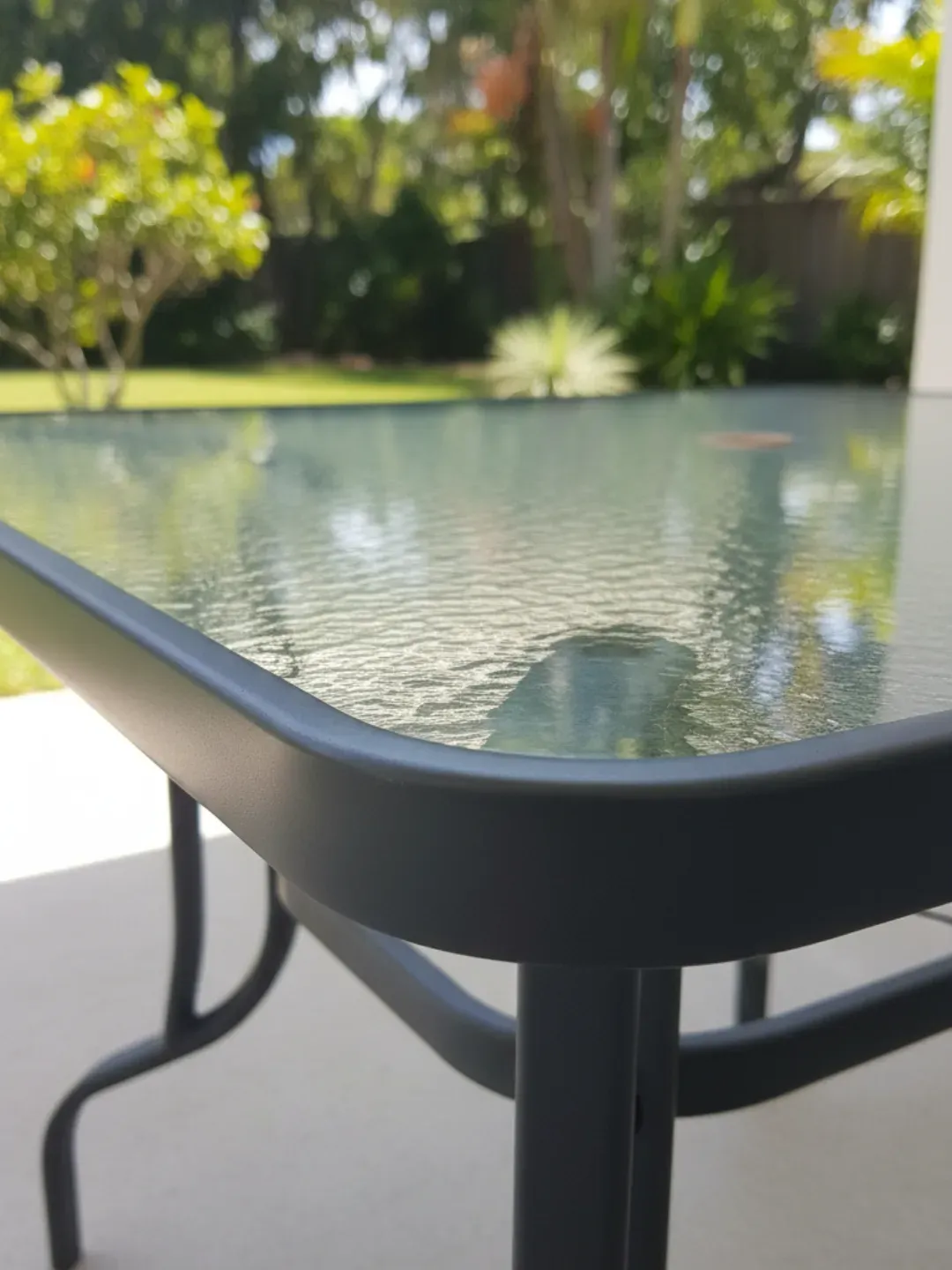 Toughened safety glass replacement tabletop in Ascot for an outdoor patio table with thick polished edges.