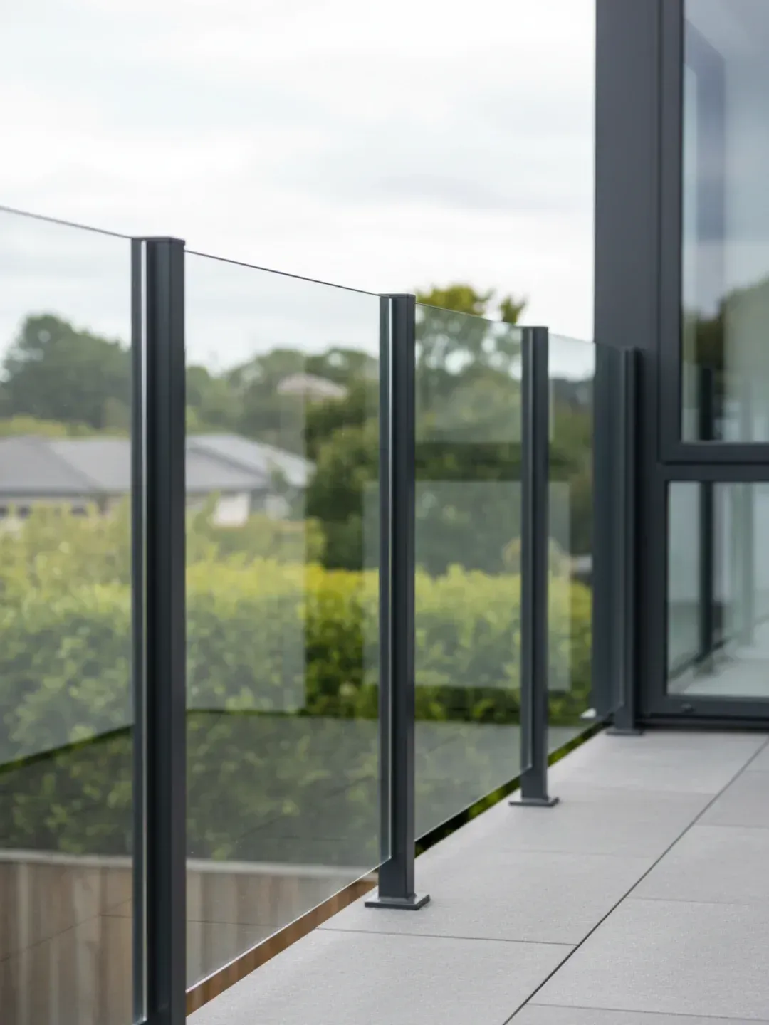 Semi-frameless glass balustrades Ascot with powder-coated aluminium posts and glass infill panels for robust compliance.